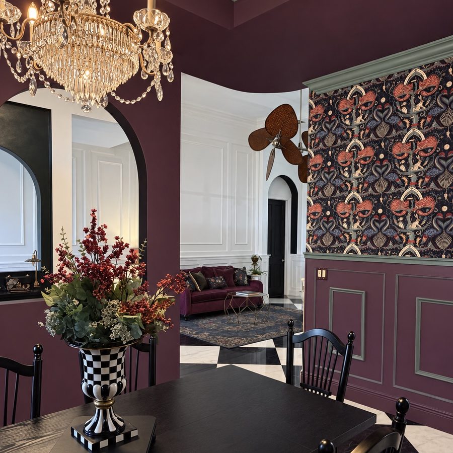 View from the plum dining room through a tall arched opening into the panelled living room beyond, with a crystal chandelier in the foreground.
